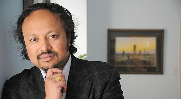 Smartly dressed, dark-haired economist Anirban Basu, Chairman & CEO of Sage Policy Group, Inc.