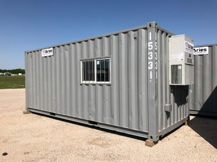 This image depicts a ground-level office housed in a converted storage container for a smaller, more compact on-site office solution.