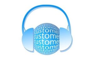A blue orb graphic with the repeating word “customer” written inside wears large over-the-ear headphones.