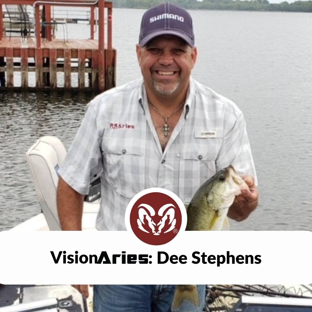VisionAries Dee Stephens: a man wearing baseball cap standing on boat smiling while holding a large fish