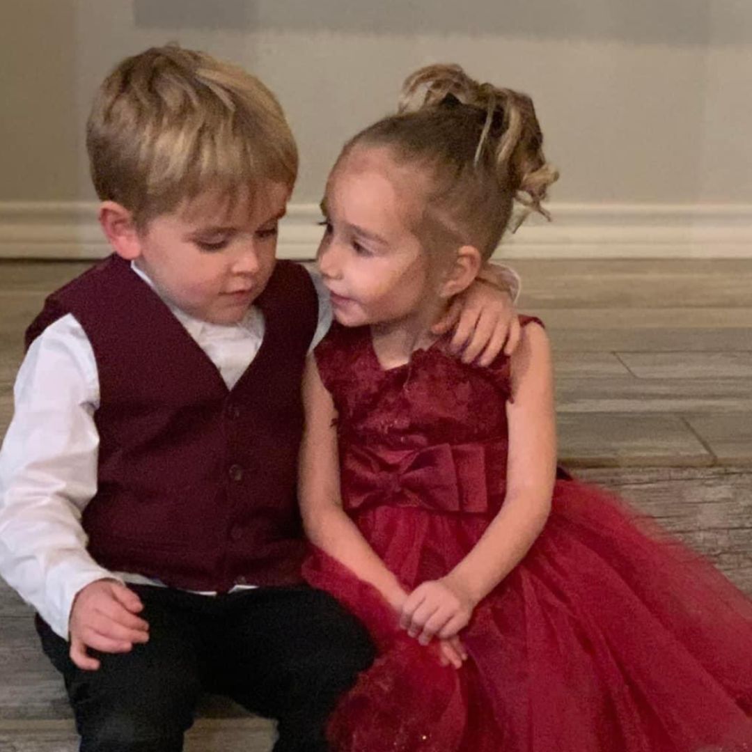 A photo of Stacey's grandson smiling adorably with a little girl.