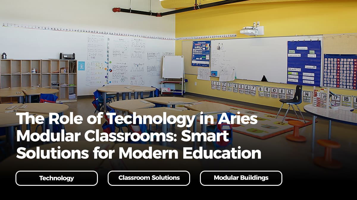 Modern modular classroom with round desks, colorful chairs, whiteboards, and integrated technology, highlighting Aries Building Systems' smart solutions for education.