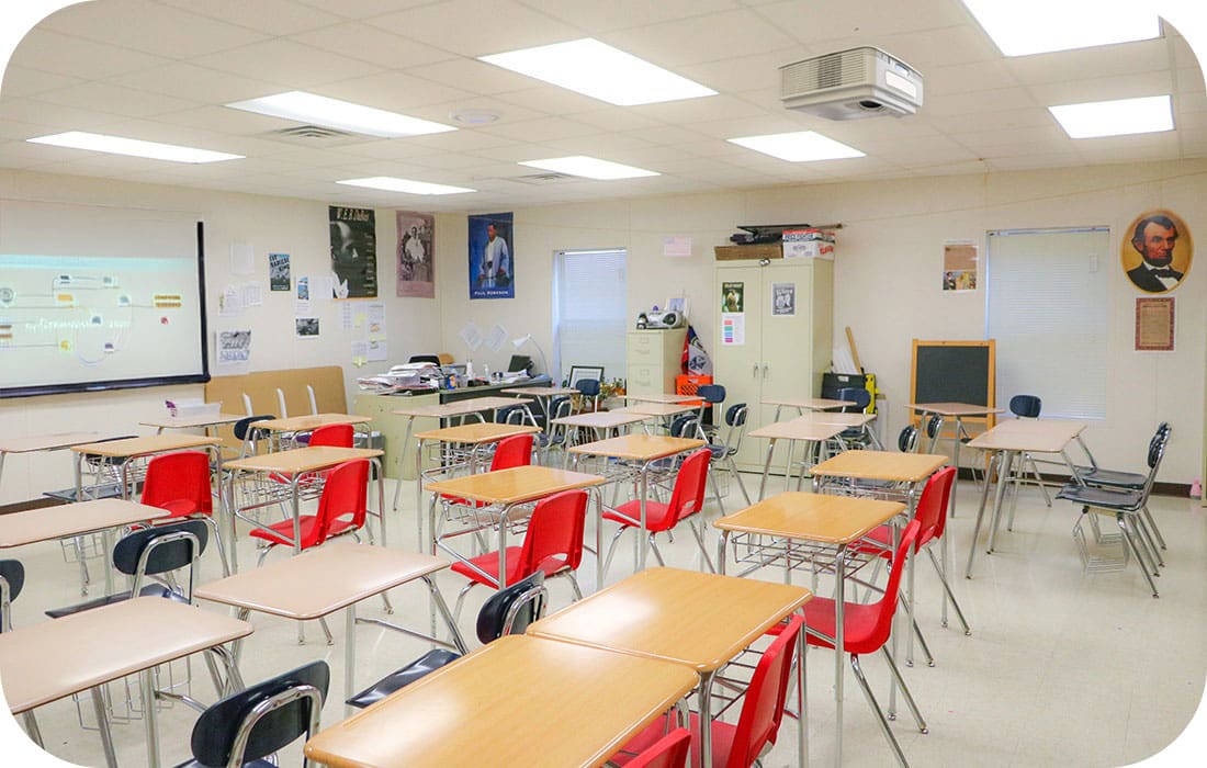 A modern Aries modular classroom equipped with collaborative desks, smart boards, and vibrant seating. This image highlights how technology in Aries modular classrooms enhances digital learning.