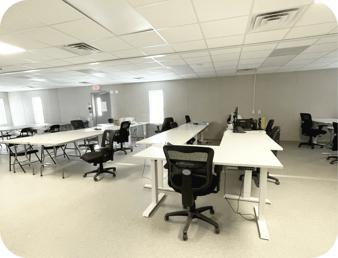 The inside of a modular office, showcasing an open floorplan work space.