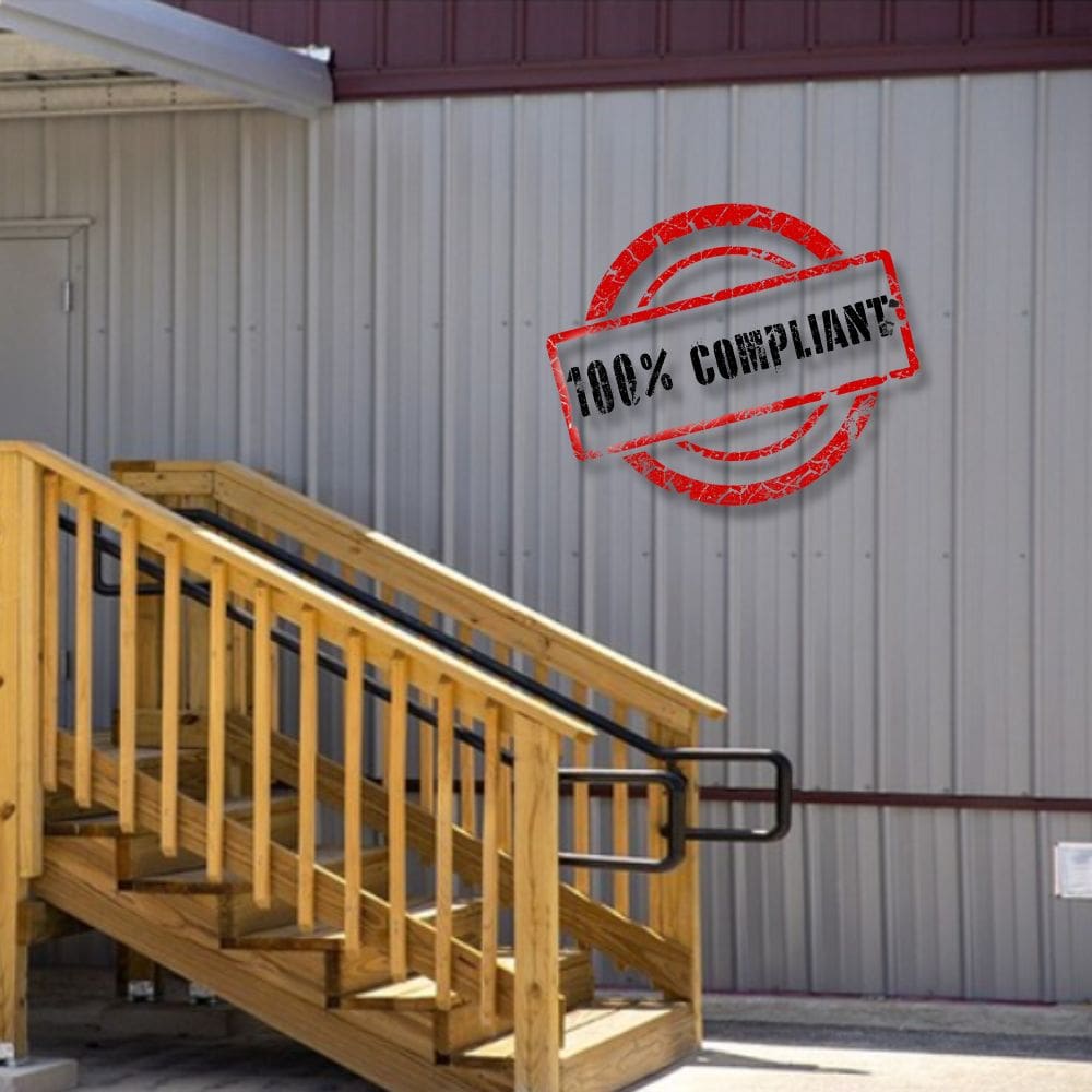 An exterior close-up shot of an Aries GSA-compliant modular building with a “100% Compliant” stamp graphic overlayed.