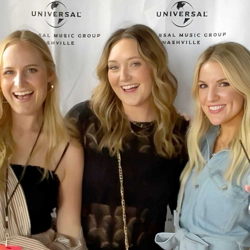 A photo of VisionAries Spotlight, Bailey Beck, smiling with friends at Universal in Nashville.