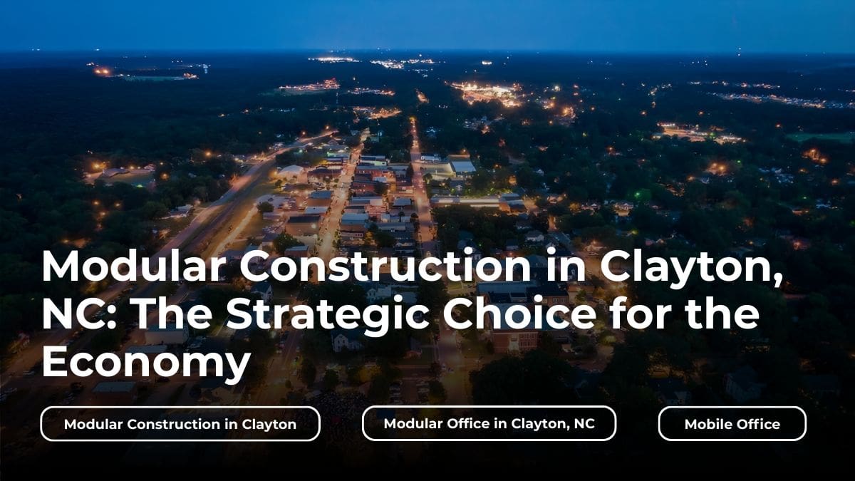An aerial view of downtown Clayton at night with bold headline text overlay reading “Modular Buildings in Clayton, NC: The Strategic Choice for the Economy,” emphasizing growth and regional development tied to modular buildings in Clayton. Supporting key words are centered underneath the title.