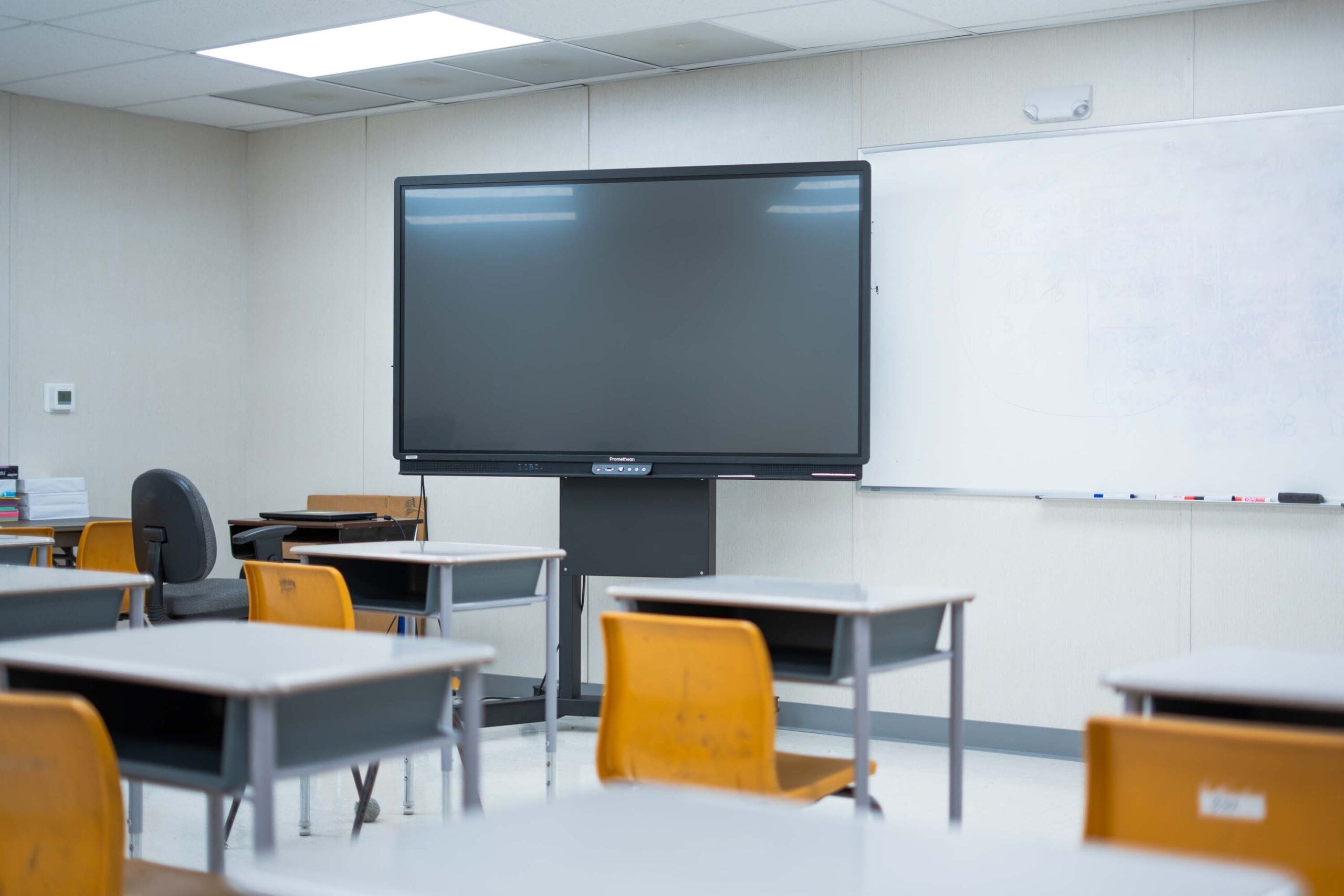 Interior of a Modern Portable Classroom in Texas Inside view of a modern portable classroom in Texas with desks and digital display.