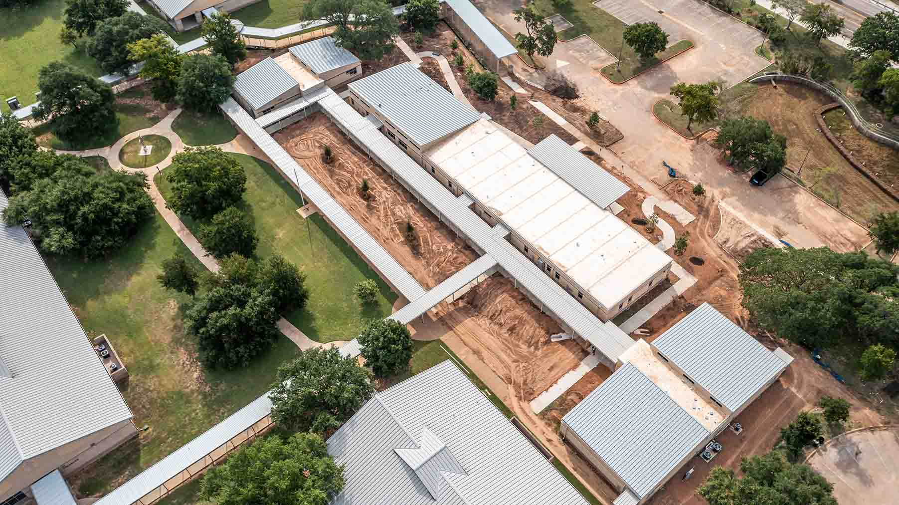 Modular School Campus Expansion with Portable Classrooms in Texas Aerial view of modular classroom installations expanding a Texas school campus.