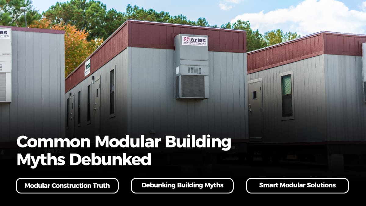 Person reviewing modular building plans, illustrating concept of Modular Building Myths Debunked