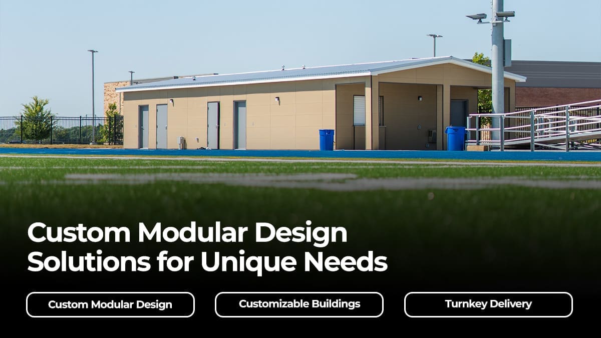 Custom modular design building installed alongside a school sports field, featuring multiple entry doors and a metal roof panel system.