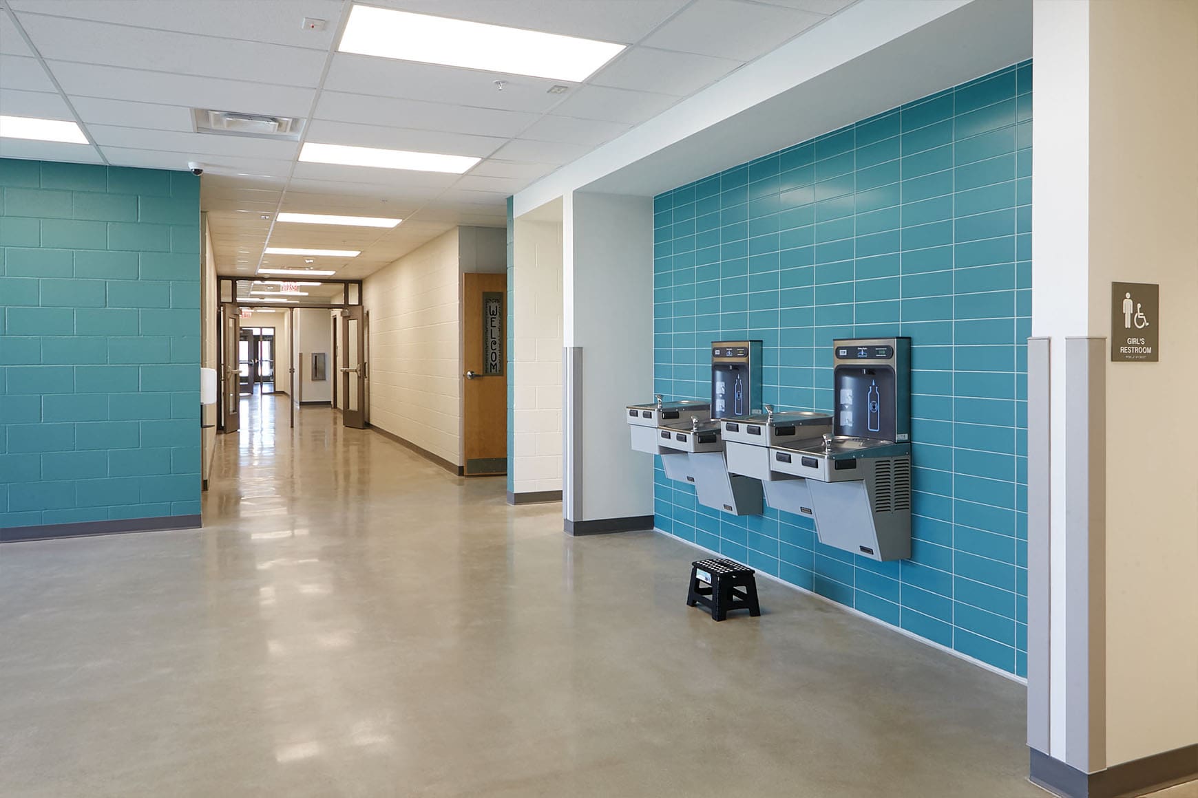 School hallway featuring bottle refill stations in a green modular construction by Aries Buildings