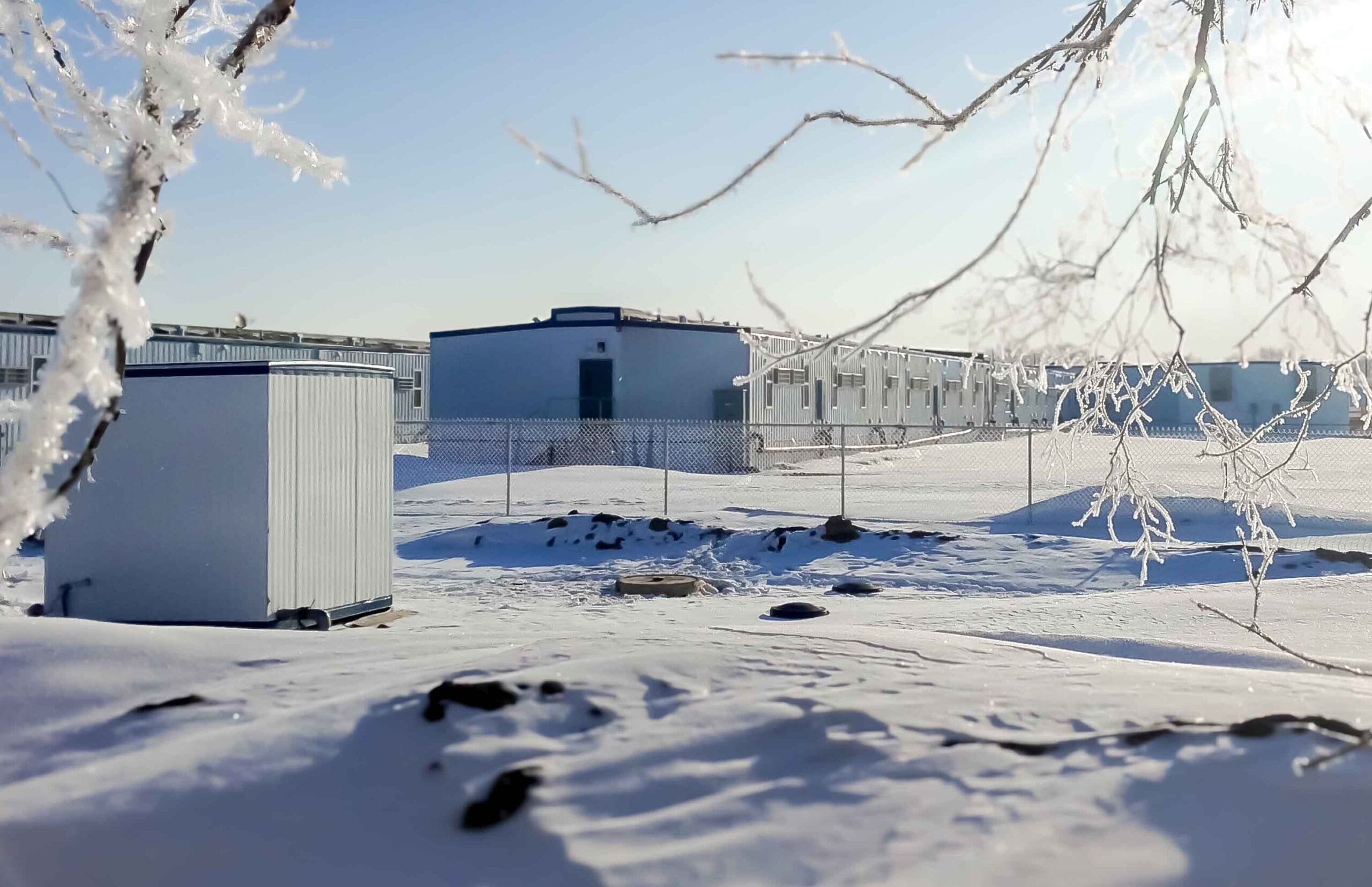 Modular buildings in snow showing need for seasonal maintenance