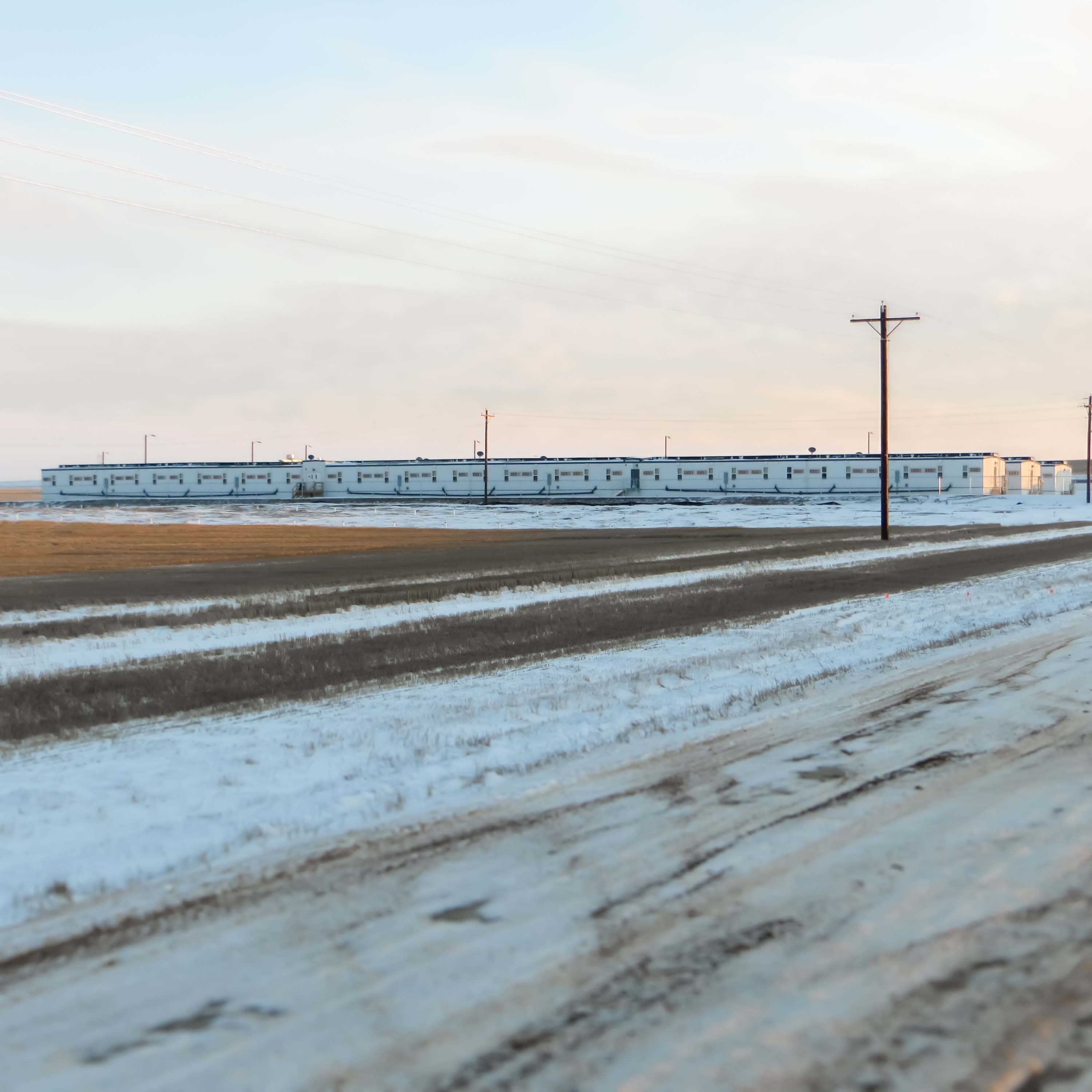 Modular Buildings on a snowy day, by Aries Building Systems Row of modular buildings during winter on snow-covered ground